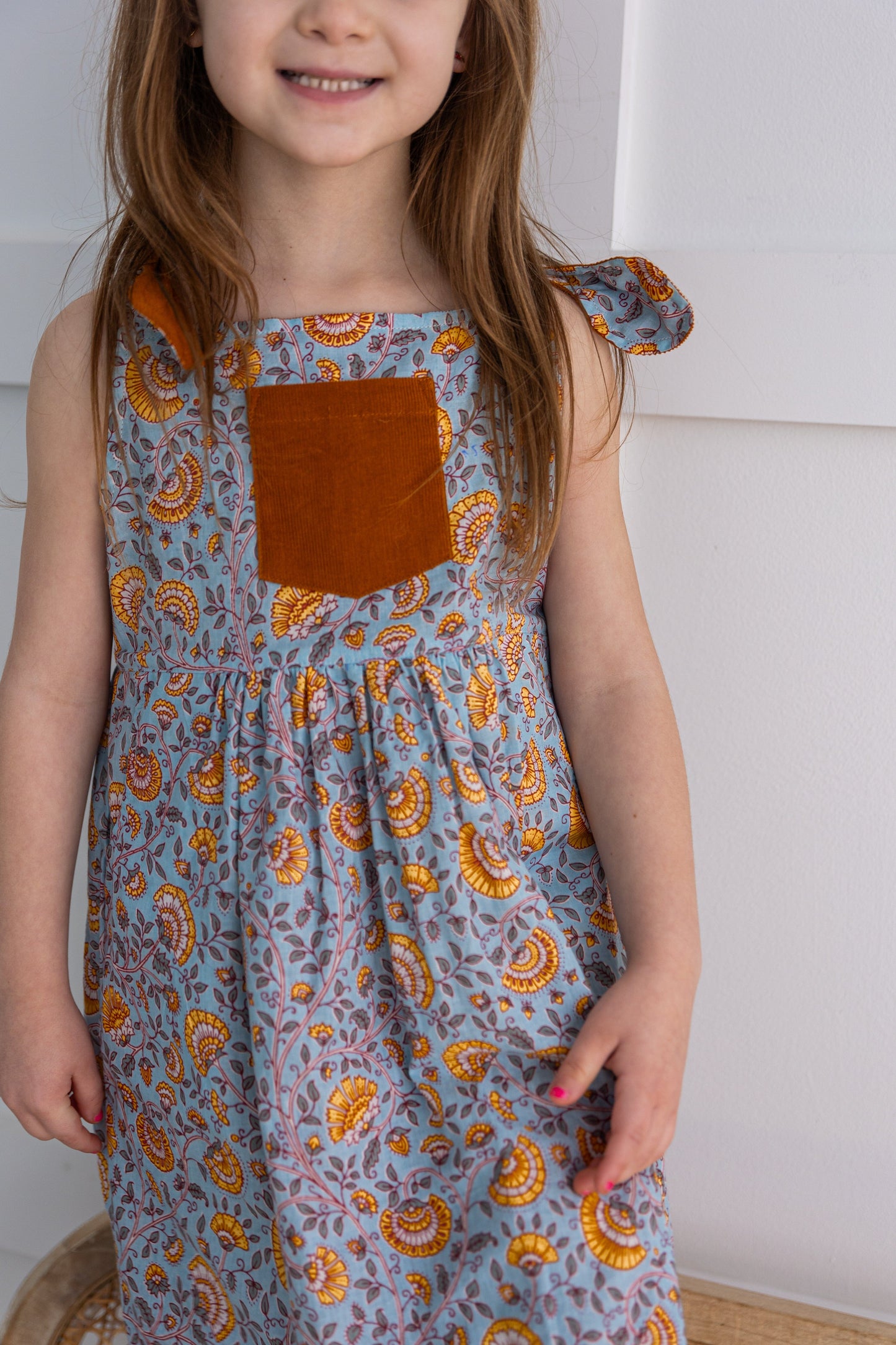 Reversible Solid Rust Corduroy & Rust Floral Printed Ruffle Dress DRESS Yo Baby India