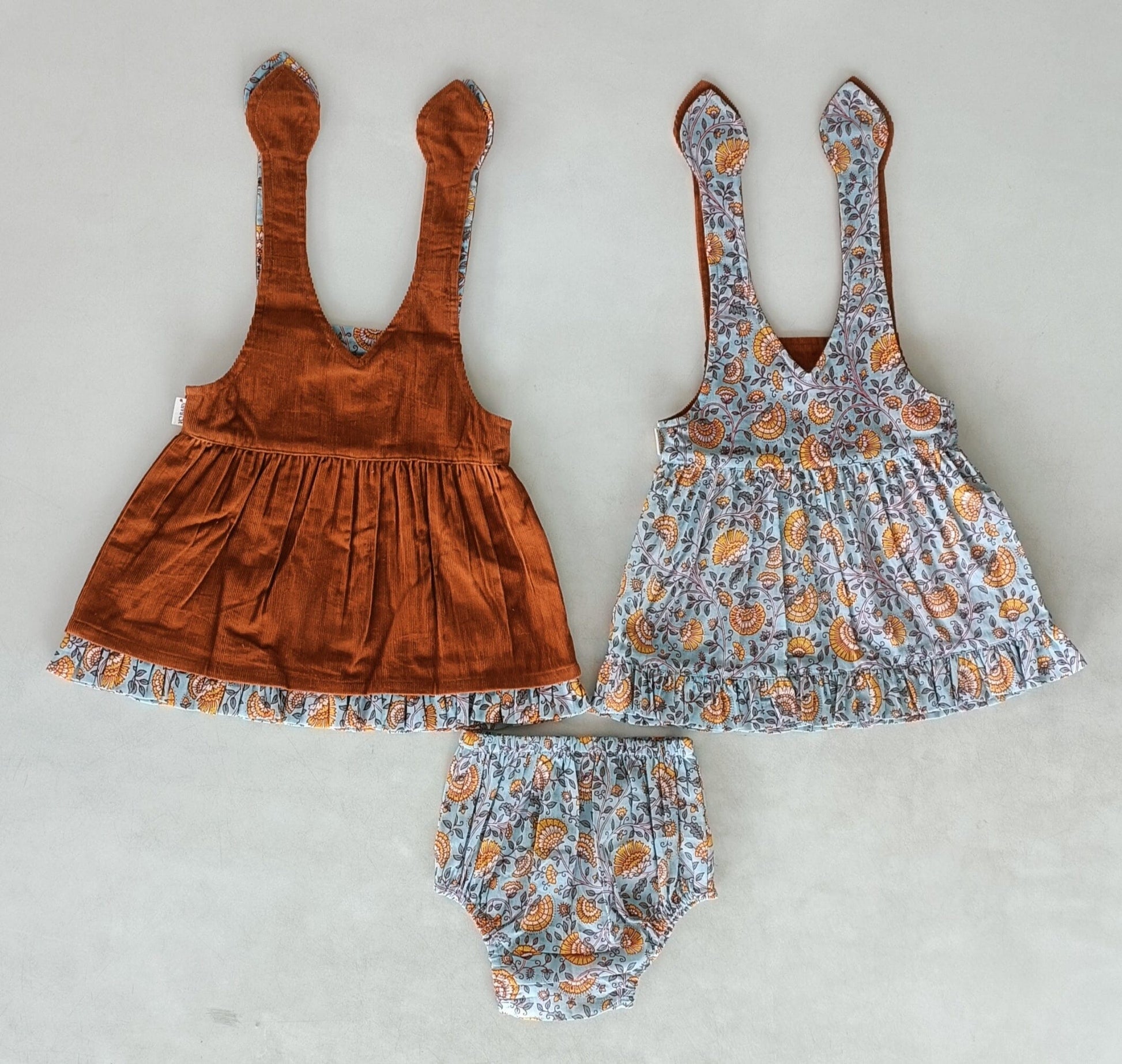 Reversible Solid Rust Corduroy & Rust Floral Printed Ruffle Dress DRESS Yo Baby India
