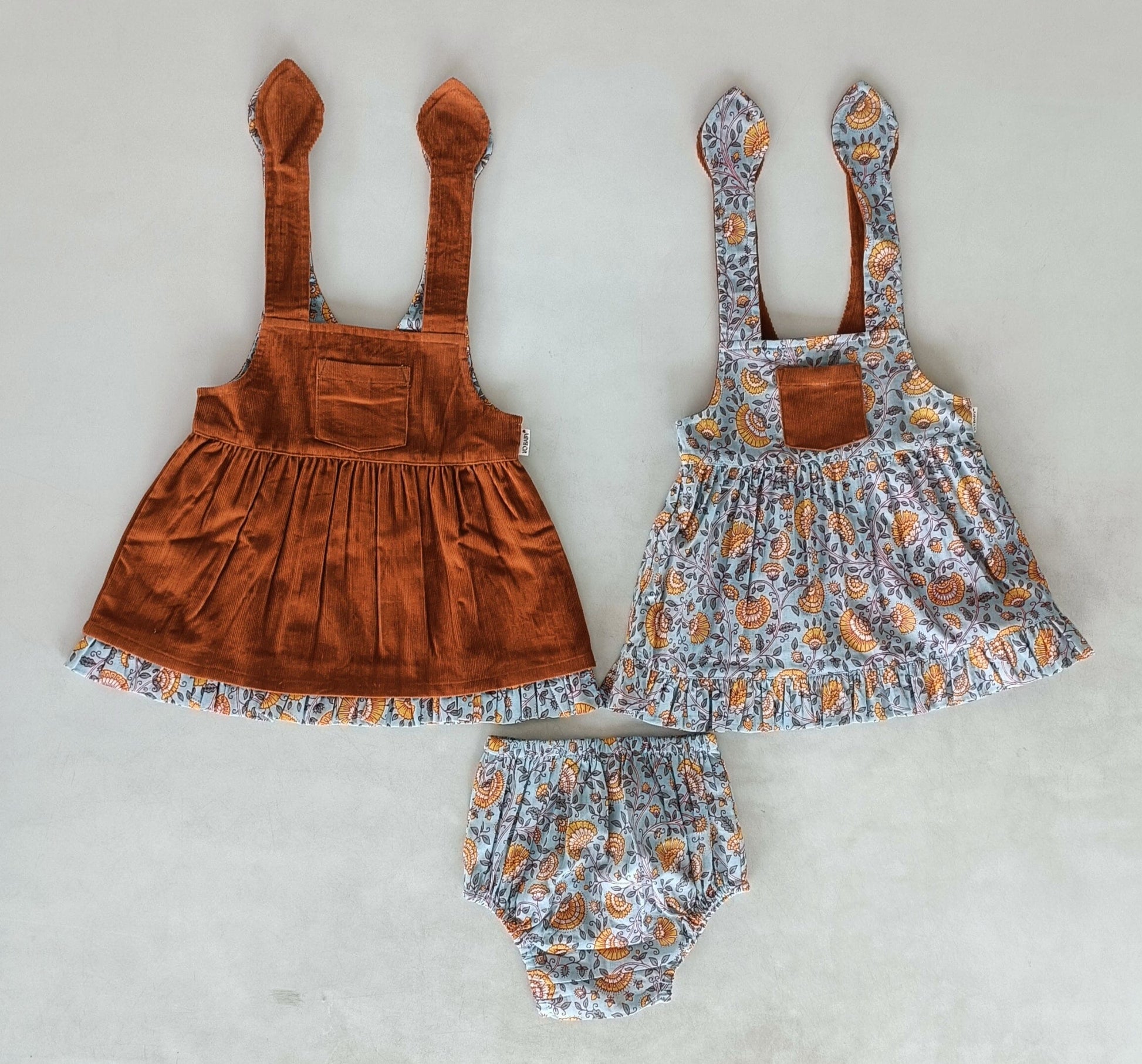Reversible Solid Rust Corduroy & Rust Floral Printed Ruffle Dress DRESS Yo Baby India